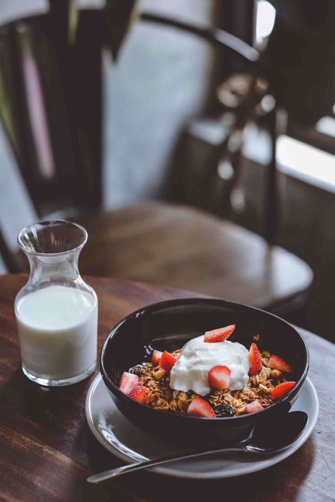 Tasty cereal and milk on the table