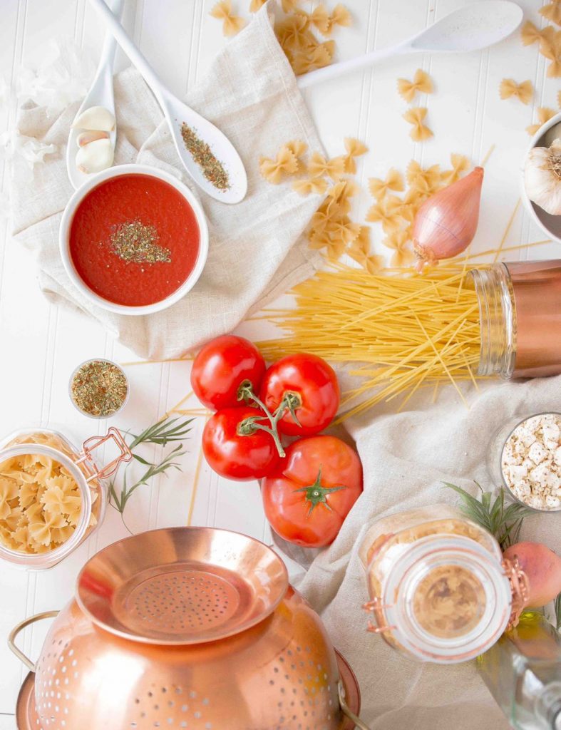 Fresh vegetables, noodles and other ingredients on the table